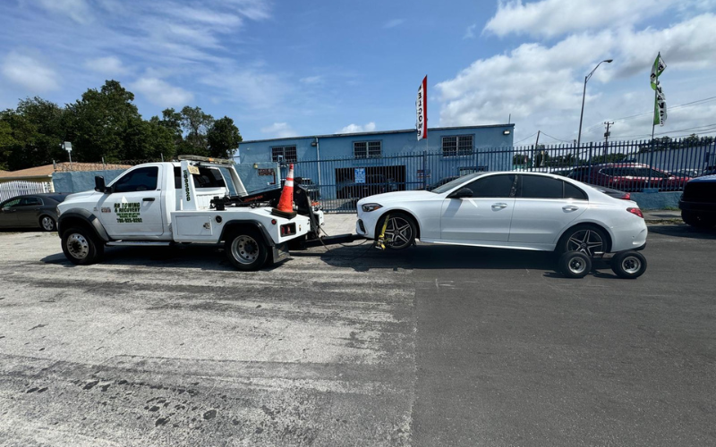 Towed white sedan